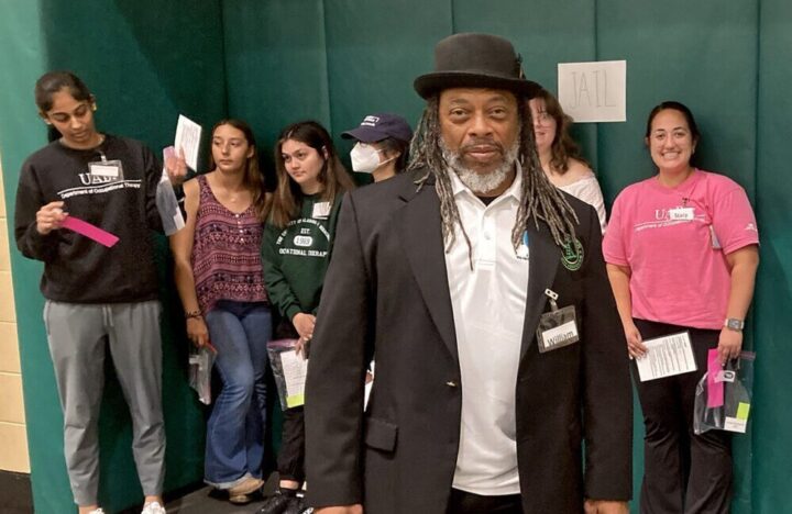 Tim Lanier stands in front of the makeshift jail, which he patrolled during the reentry simulation activity at UAB’s recreation center, on March 24, 2023. (Mary Scott Hodgin/WBHM)